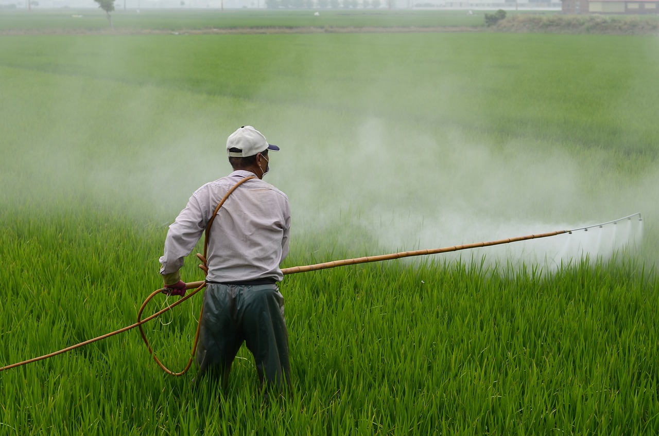 Farming applying herbicide in a farm